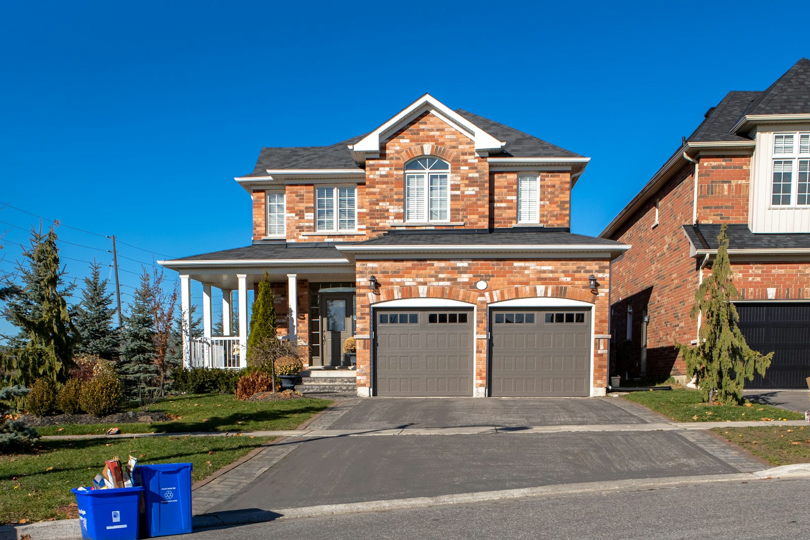 Conventional residential garage doors on a suburban home